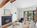 Bright living room featuring a fireplace, sliding glass doors, and modern décor at 40 S Boulder Cir # 4033, Boulder, CO 80303