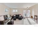 Spacious living room featuring large windows and comfortable seating at 620 Pearl St # E, Boulder, CO 80302