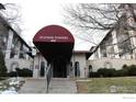 Spanish Towers entrance with covered awning and well maintained landscaping at 805 29Th St # 157, Boulder, CO 80303