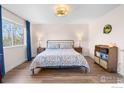Comfortable bedroom with a large window, soft lighting, and a relaxed, inviting ambiance at 1485 Stoneham St, Superior, CO 80027