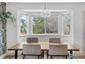 Comfortable dining nook with bay windows offering great natural light and a nature view at 1485 Stoneham St, Superior, CO 80027