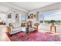 Bright living room with large windows and hardwood floors at 1585 Hecla Way # 304, Louisville, CO 80027