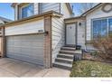Home featuring a front entrance with four stairs leading to the front door and a two car garage at 21656 Hill Gail Way, Parker, CO 80138