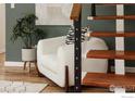 Cozy living room featuring a comfortable chair, modern staircase and stylish decor at 2420 9Th St # 4, Boulder, CO 80304