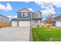 A new home with a two-car garage, beautiful landscaping, and stone accents is move-in ready at 262 Chardon Ave, Brighton, CO 80601