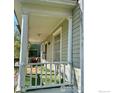 Inviting front porch with white railings and columns, perfect for enjoying the outdoors at 525 Gay St, Longmont, CO 80501