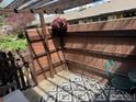Outdoor patio area with a privacy fence, pergola, and a stylish outdoor rug, perfect for relaxing at 6524 W 14Th Ave, Lakewood, CO 80214