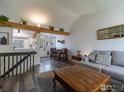 Inviting living room featuring hardwood floors, vaulted ceilings, and an open layout at 13146 Raritan Ct, Westminster, CO 80234