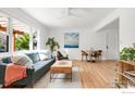 Bright living room with hardwood floors, neutral decor, and a large window at 220 28Th St, Boulder, CO 80305