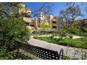 Multi-story condo building surrounded by mature trees and landscaping at 2711 Mapleton Ave # 27, Boulder, CO 80304