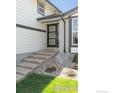 A modern front door is accessible by stone steps at 4223 Peach Way, Boulder, CO 80301