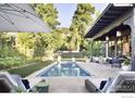 Luxury pool and patio with lounge chairs for relaxation at 440 Japonica Way, Boulder, CO 80304