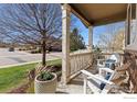Inviting front porch with comfortable seating, offering a relaxing outdoor space at 4737 Sandy Ridge Ave, Firestone, CO 80504