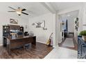 Well-lit office featuring hardwood floors, a ceiling fan, and ample space for a large desk at 4737 Sandy Ridge Ave, Firestone, CO 80504