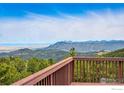 Breathtaking mountain views from the spacious wooden deck, perfect for enjoying the serene landscape at 531 Sky Trail Rd, Boulder, CO 80302