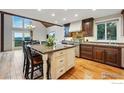 Gourmet kitchen featuring a center island, granite countertops, stainless steel appliances, and scenic views at 531 Sky Trail Rd, Boulder, CO 80302