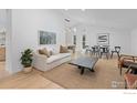 Bright and airy living room with vaulted ceilings, modern decor, and ample natural light at 586 Aztec Dr, Boulder, CO 80303
