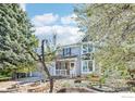 Charming two-story home with well-manicured yard and attached two-car garage at 951 Vetch Cir, Lafayette, CO 80026