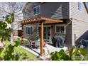 Outdoor patio with pergola, complete with grill and dining set at 956 Shavano Peak Dr, Superior, CO 80027