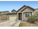 Inviting front entrance with covered porch and well-manicured landscaping at 12853 E 108Th Ave, Commerce City, CO 80022