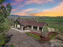 Gorgeous ranch style home featuring professional landscaping and stunning mountain views at 205 S County Road 23, Berthoud, CO 80513