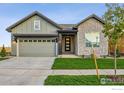 Charming home exterior with a well-maintained lawn, modern design, and inviting curb appeal at 3010 Newfound Lake Rd, Berthoud, CO 80513