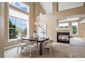 Dining room with chandelier, large windows, and fireplace at 3122 Notabon Ct, Lafayette, CO 80026