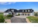 Beautifully landscaped home with a three-car garage and a spacious driveway at 3796 Vale View Ln, Mead, CO 80542