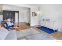 Open-concept living space with modern furnishings and hardwood flooring at 4965 Twin Lakes Rd # 68, Boulder, CO 80301