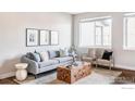 Bright living room features a modern decor and ample natural light at 11488 E 25Th Dr, Aurora, CO 80010