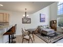 Open concept living and dining area featuring a tall ceilings and bright windows at 1757 High Plains Ct, Superior, CO 80027