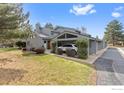 Inviting home exterior with a covered parking area and well-maintained lawn and shrubbery at 1990 Joslyn Pl, Boulder, CO 80304