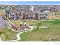 Beautiful aerial view showcases the property's prime location near the park and community playground at 2338 Irons St, Erie, CO 80516