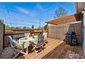 Cozy outdoor deck with dining table, chairs, grill, and privacy fence, perfect for entertaining at 2955 N Columbine St, Denver, CO 80205