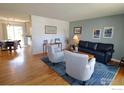 Inviting living room featuring hardwood floors and stylish furnishings, perfect for relaxation at 308 Baron Ave, Lafayette, CO 80026