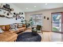 Bright living room featuring a comfortable leather couch and stylish decor at 348 Eisenhower Dr, Louisville, CO 80027