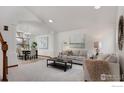 Inviting living room with large windows and an open layout to the dining area at 4866 Franklin Dr, Boulder, CO 80301