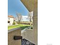 Condo exterior showcasing green lawn and a view from the balcony at 5035 W 73Rd Ave, Westminster, CO 80030