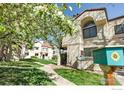 Charming condo with green lawn and blossoming tree creating an inviting landscape at 5035 W 73Rd Ave, Westminster, CO 80030
