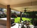 Covered patio with ceiling fan, hot tub and outdoor dining furniture, perfect for relaxing or entertaining at 536 Tipple Pkwy, Frederick, CO 80530