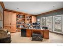 Home office with custom built-in shelving and ample workspace at 5442 S Dayton Ct, Greenwood Village, CO 80111