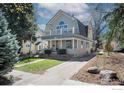 Beautiful two-story home with a spacious driveway, complemented by a well-maintained lawn and landscaping at 1013 4Th Ave, Longmont, CO 80501