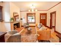 Bright living room showcases a fireplace, hardwood floors, and neutral colors at 1114 5Th Ave, Longmont, CO 80501