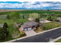 Ranch home with a three-car garage, basketball court, and stunning mountain views at 11669 Montgomery Cir, Longmont, CO 80504