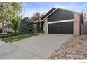 Inviting front exterior showcasing the home's facade, landscaping, and spacious driveway at 1181 Dover Way, Broomfield, CO 80020