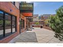 Building exterior with a patio area and nice landscaping at 1360 Walnut St # 211, Boulder, CO 80302