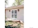 Close-up view of the home's exterior with double glass doors at 1891 Orchard Ave, Boulder, CO 80304
