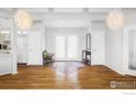 Bright foyer with hardwood floors, stylish lighting, and an inviting atmosphere at 1891 Orchard Ave, Boulder, CO 80304