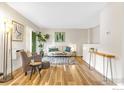 Bright living room featuring hardwood floors, a modern sofa and a stylish area rug at 3035 Oneal Pkwy # 19, Boulder, CO 80301