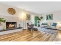Cozy living room with hardwood floors, fireplace and lots of natural light at 3035 Oneal Pkwy # 19, Boulder, CO 80301